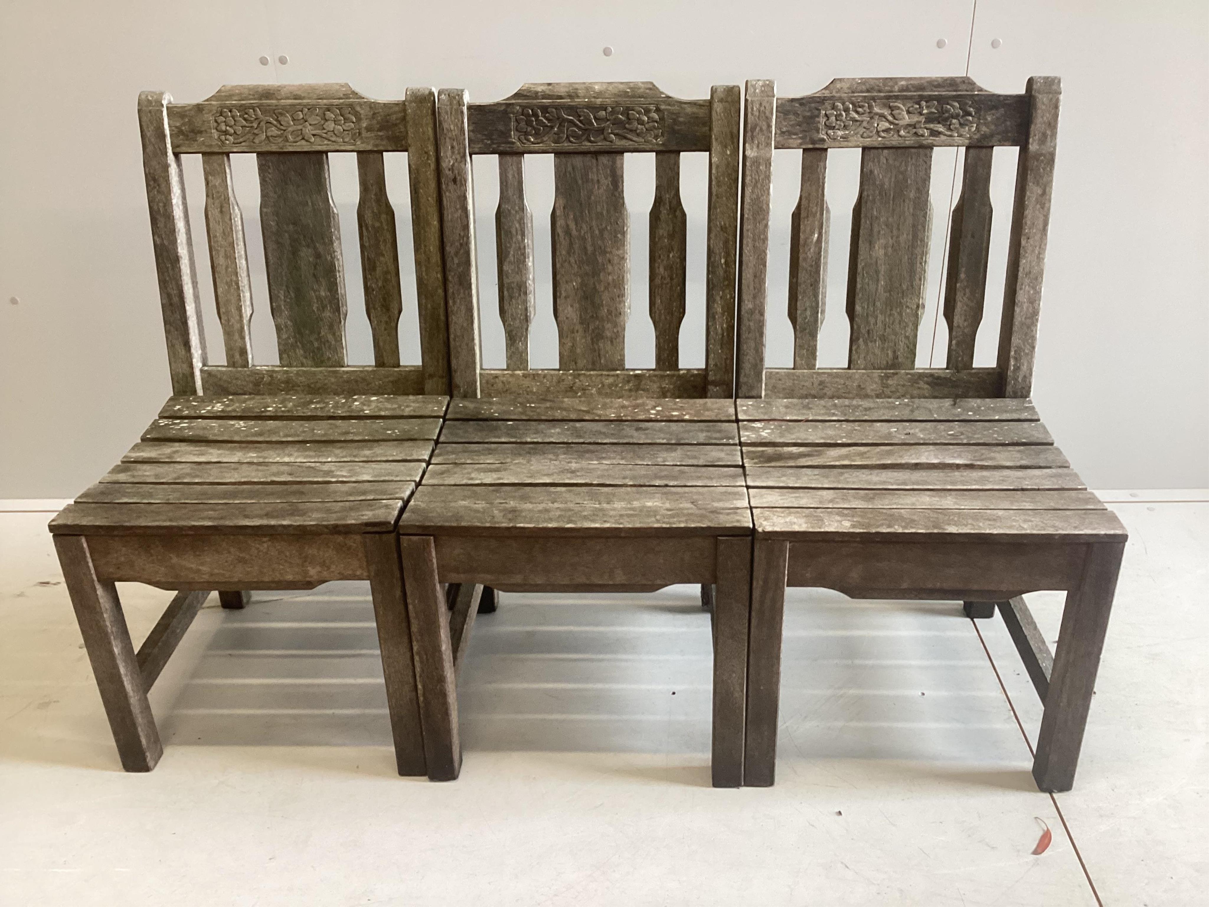 A vintage Bridgman & Co iroko hardwood rectangular garden table, width 182cm, depth 122cm, height 74cm and five chairs, two with arms. Condition - fair